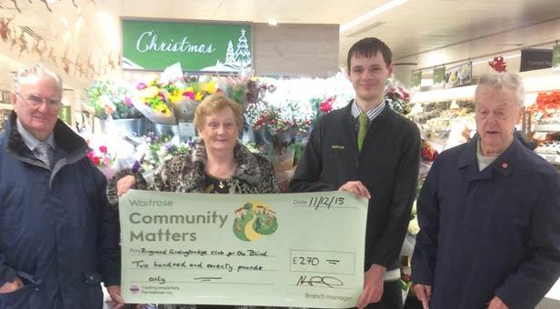 Jean and Gerry Postill and John Reading being presented with cheque from Waitrose