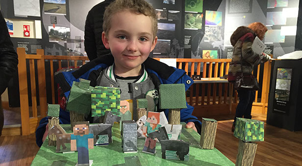 Seven year old Luke Alexander from Dibden with his Minecraft model of the Rufus Stone near Brook