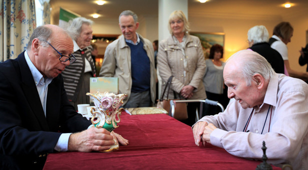 Charles Wallrock of Wick Antiques (left) gives his valuation of an ornament at Amberwood House's public open day