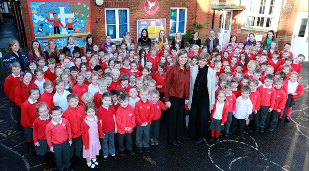 New head of school at St John's First School Katharine Anstey (centre left) pictured with Wimborne Academy Trust chief executive Liz West (centre right), pupils and staff