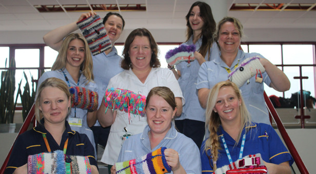RBH specialist dementia nurses Rachael Davies and Kelly Lockyer show off the twiddle mitts with BU student midwives Alison Peters and Hannah Pilling, BU student occupational therapist, Siana Kennelly and BU student adult nurses Beth Gibson, Michele Miles and Suzanne Slater