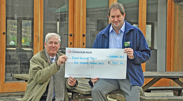 From left, Rupert Vaughan and Simon Cripps in front of Swallow Barn at the trust’s Kingcombe Centre near Maiden Newton