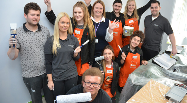 Louise Renshaw (rear 4th left) Mike Nicolson (rear 5th left) with the B & Q team and students