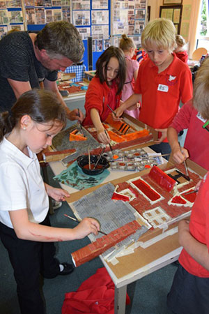 Artist Darrell Wakelam shows St John’s First School pupils how to decorate the 3D Models