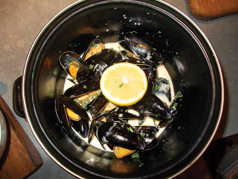 Moules frites or mussels served
in a cream and white wine sauce