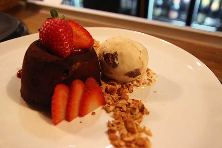 Dark Chocolate Fondant with Hazelnuts and Rum and Raisin Ice Cream, West Beach