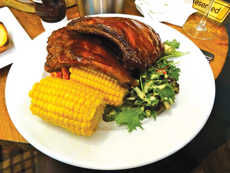 Avon Causeway: Rack of barbecue ribs with corn on the cob, sweet potato fries and dressed leaves