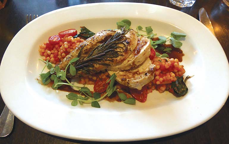 Chicken breast with Fregula pasta and wilted baby spinach