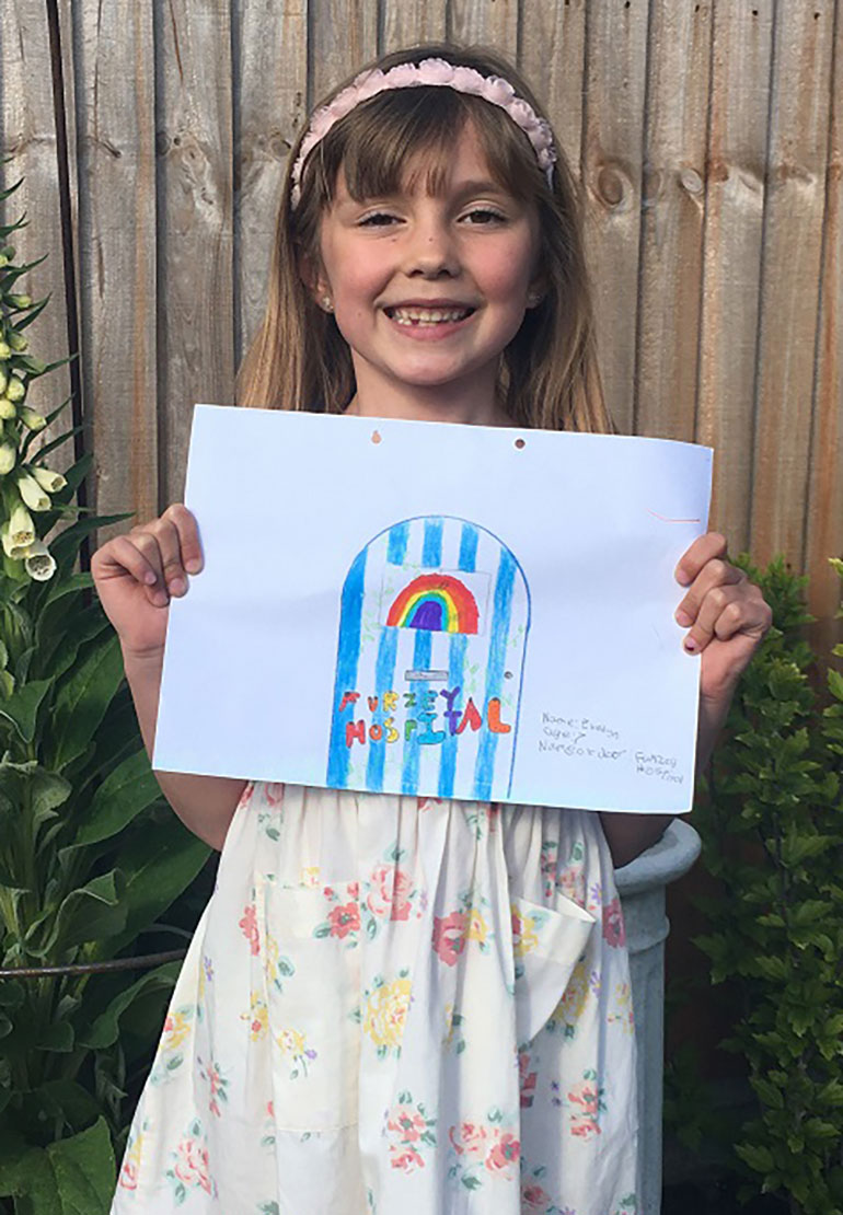 Winning design 7-11 category: Evelyn (7) with her Furzey Hospital design incorporating a rainbow