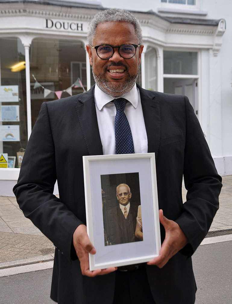 Nick Douch with a photo of his great-grandfather