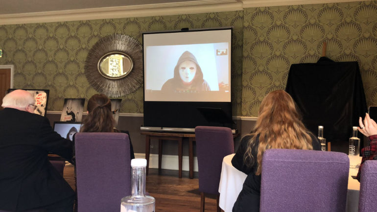 Man in a mask claiming to be The Original Banksy at the event at the Green House, Bournemouth via Zoom