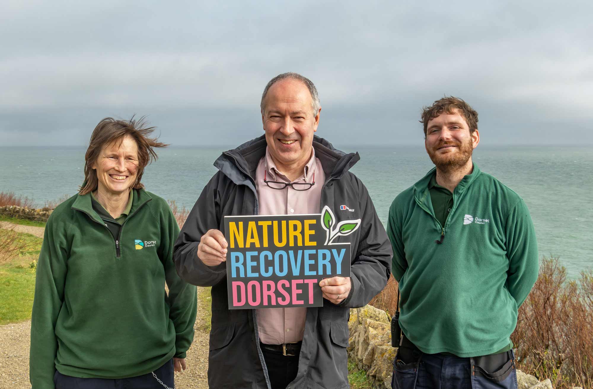 Dorset Council leader, Cllr Nick Ireland (centre), meets rangers at Durlston Country Park, Swanage