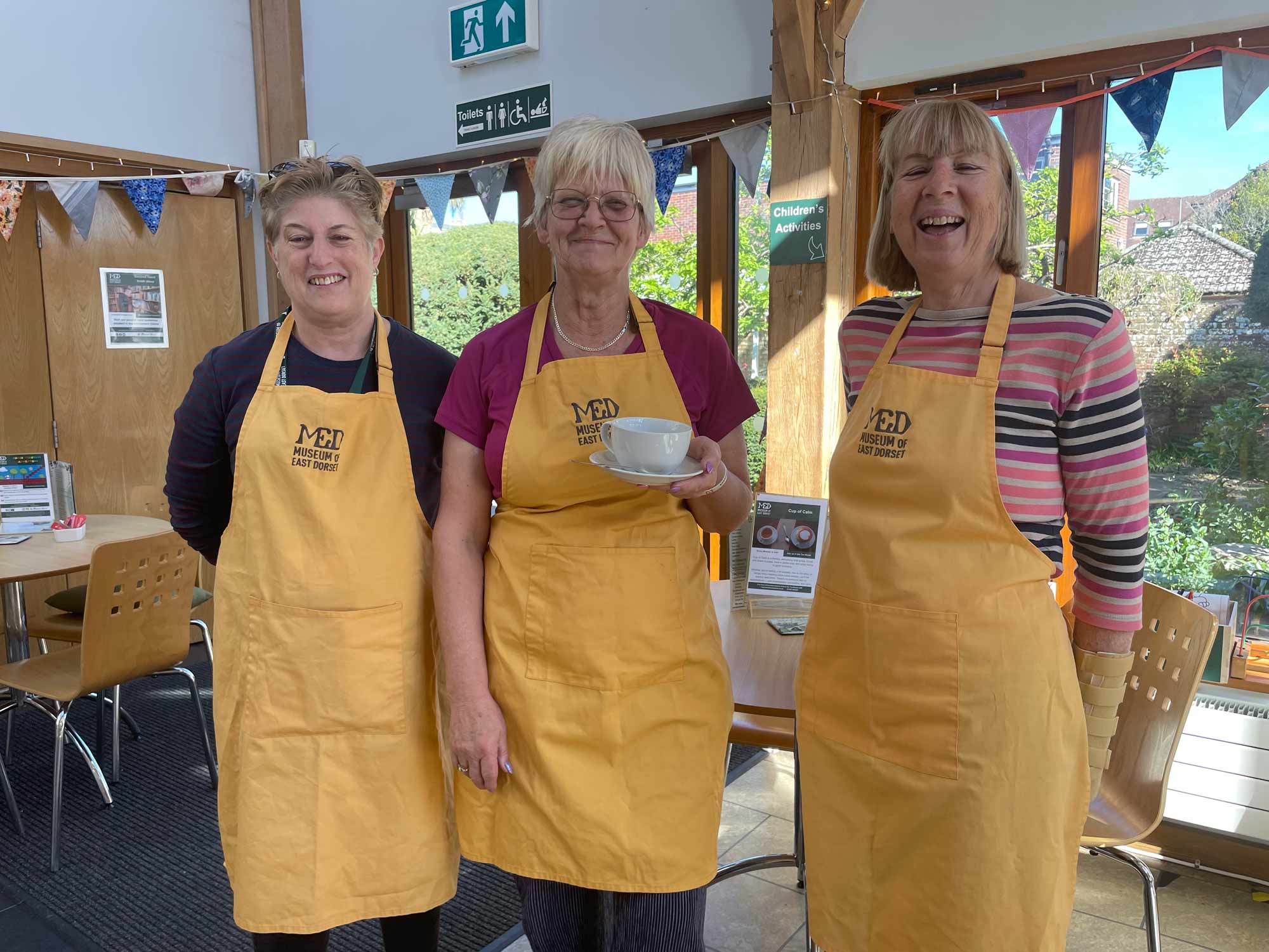 Volunteers Michelle Bartlett and Karen Cox with tea room manager Lorraine Lewis © BBPR