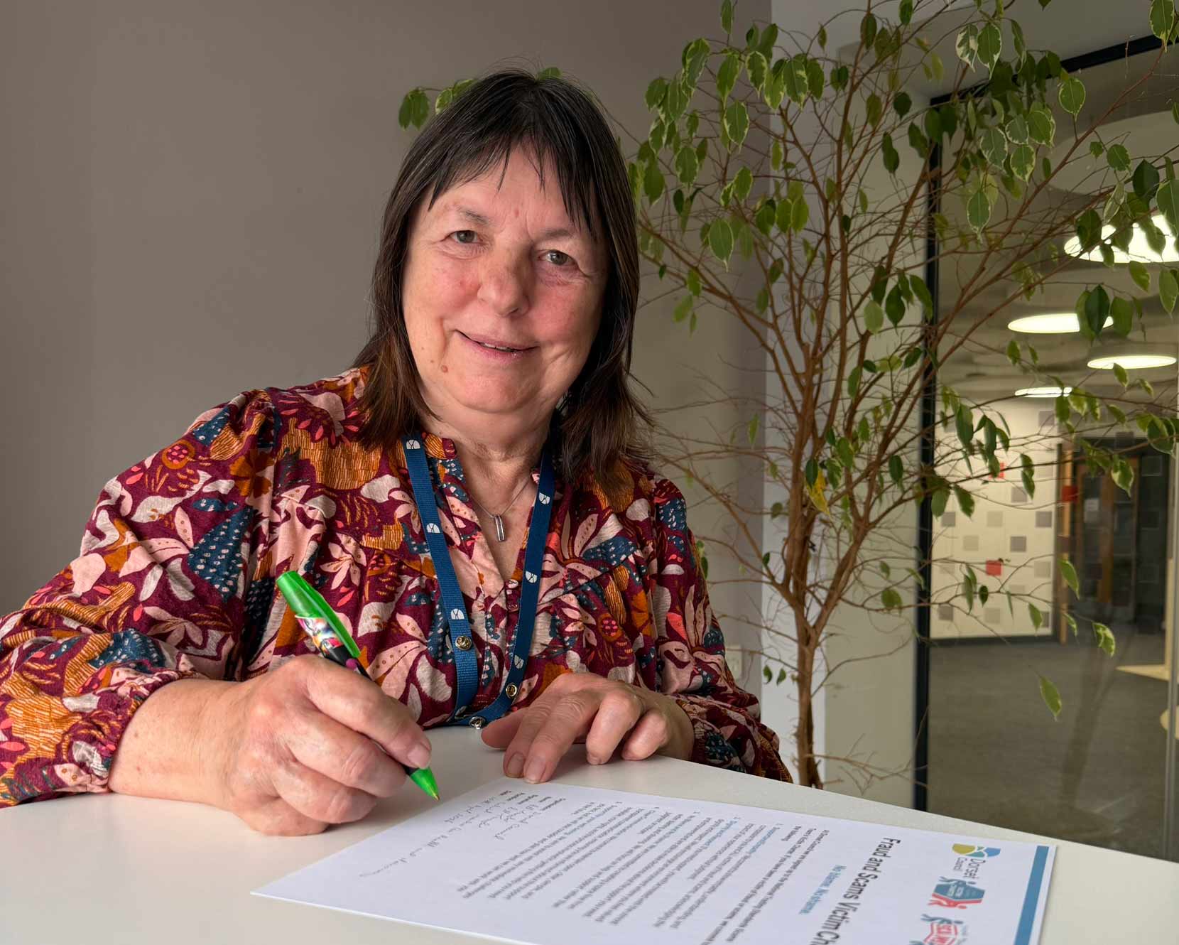 Cllr Gill Taylor signs the charter