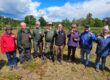 Air quality volunteers with Tim Newman holding sample tubes at Matchams View