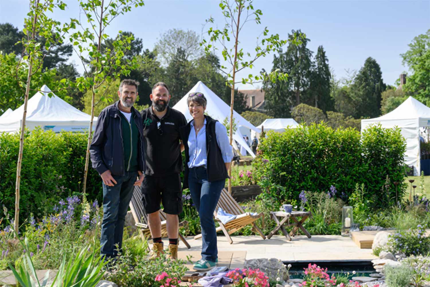 Showcase Garden: Nature’s Spa by Vicky Lincoln and Rob Woodhouse pictured with Gardeners’ World presenter Adam Frost, Award: Gold