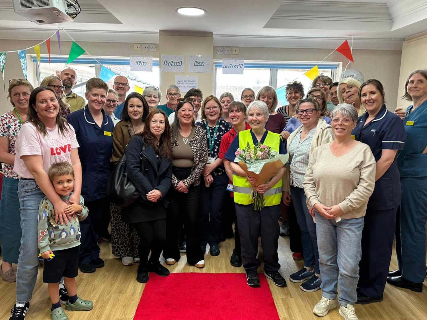 Nurse Carmel enjoying a send off from Forest Holme Hospice colleagues