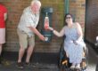 Mayor of Wimborne Minster and Jordan Hilton a local resident using the new free water fountain at Cook Row.