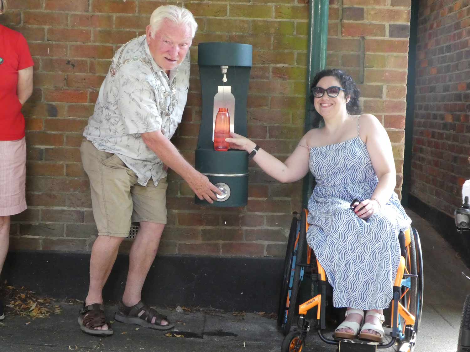 Mayor of Wimborne Minster and Jordan Hilton a local resident using the new free water fountain at Cook Row.