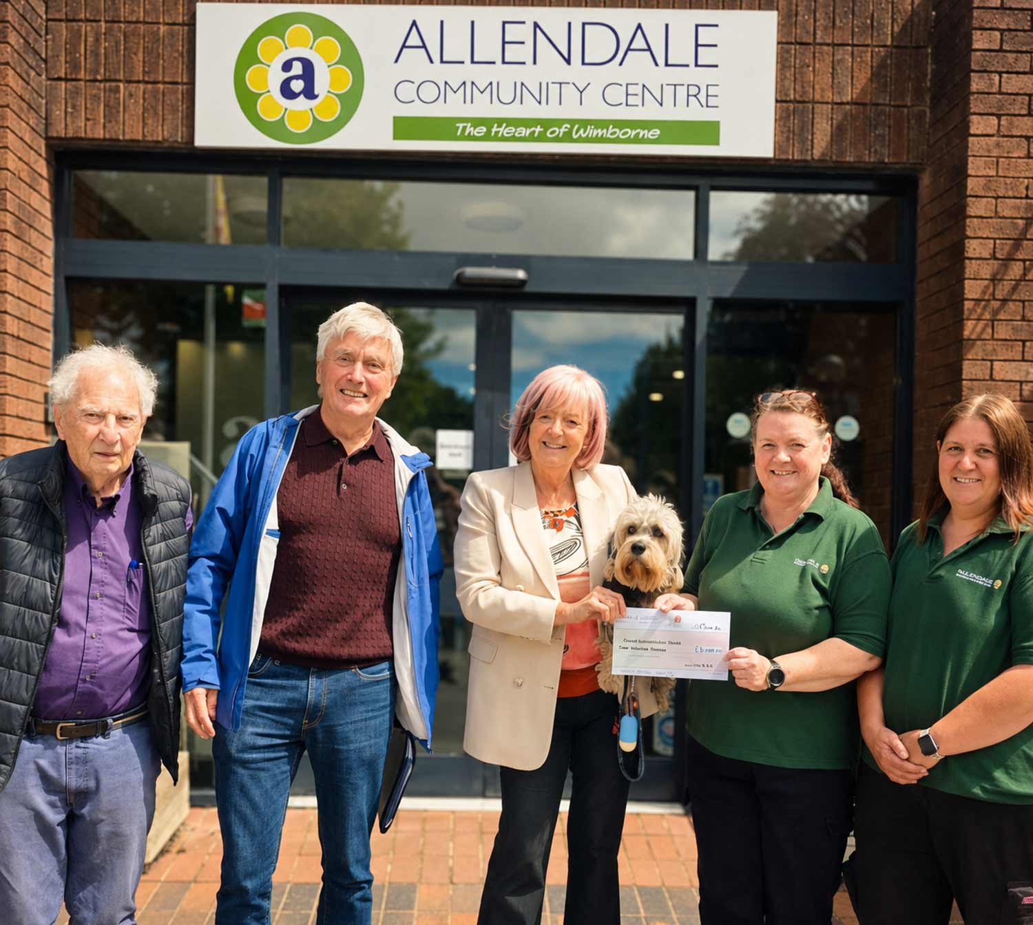 L-R: David Phelps, John Sibbett (both trustees of the Allendale Community Centre), Michelle Fuller (volunteer with Ronnie the Dandie Dinmont), Karen Hill and Elisa Way from Poole and Wimborne Woodland Burial