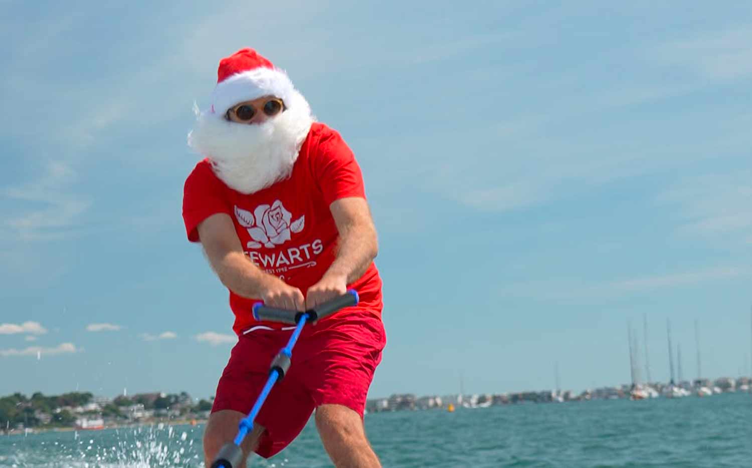 Santa surfing on holiday