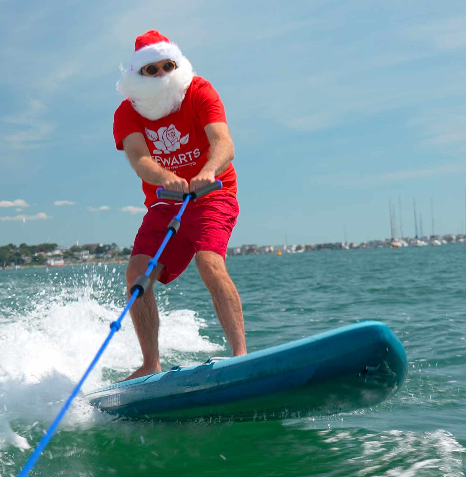 Santa surfing on holiday