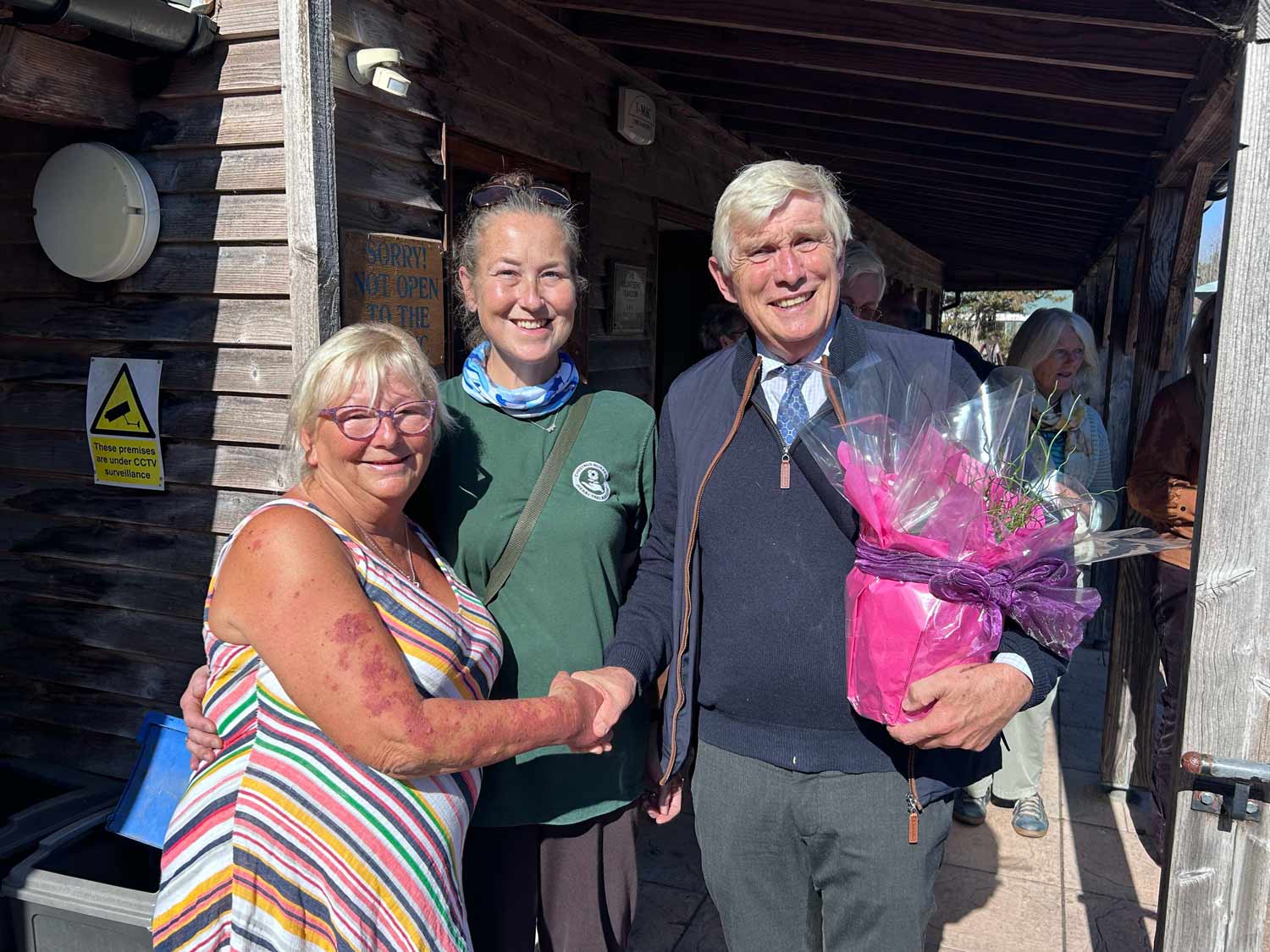 Cherry Tree Team members present Professor Dooley with planter